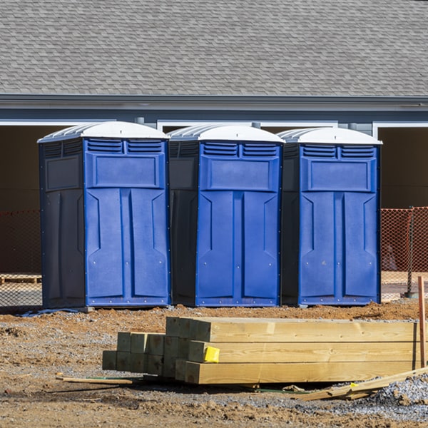 what is the cost difference between standard and deluxe portable toilet rentals in Otisco Michigan